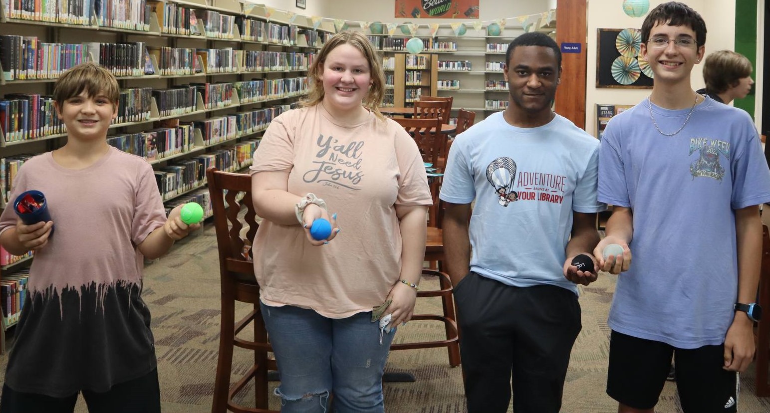 Four Teens showing off dragon eggs